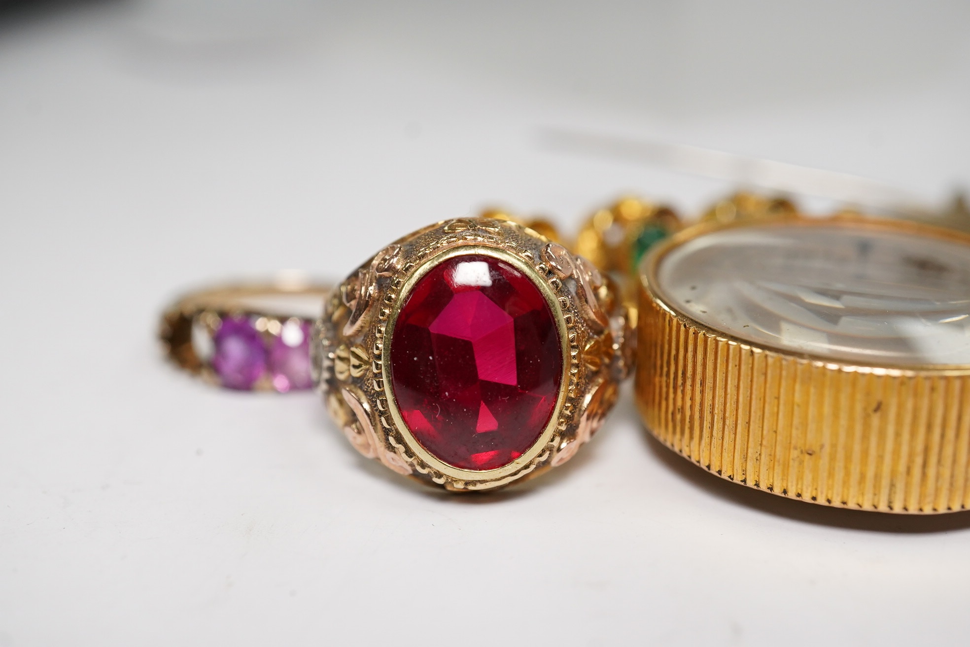 A small group of assorted jewellery including a coral necklace, 9c compass fob, five yellow metal items including a ring, locket and brooch and a stick pin. Condition - poor to fair